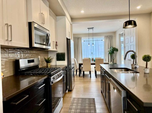 399 Sora Boulevard Se, Calgary, AB - Indoor Photo Showing Kitchen With Double Sink With Upgraded Kitchen