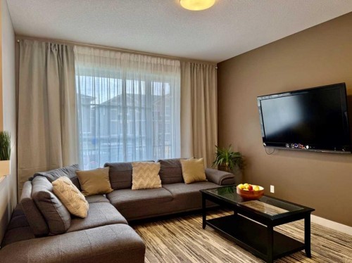 399 Sora Boulevard Se, Calgary, AB - Indoor Photo Showing Living Room
