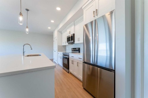 2410-42 Cranbrook Gardens Se, Calgary, AB - Indoor Photo Showing Kitchen With Stainless Steel Kitchen With Upgraded Kitchen