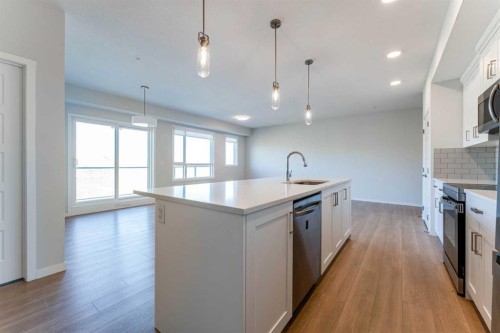 2410-42 Cranbrook Gardens Se, Calgary, AB - Indoor Photo Showing Kitchen With Upgraded Kitchen