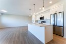 2410-42 Cranbrook Gardens Se, Calgary, AB  - Indoor Photo Showing Kitchen With Stainless Steel Kitchen With Upgraded Kitchen 