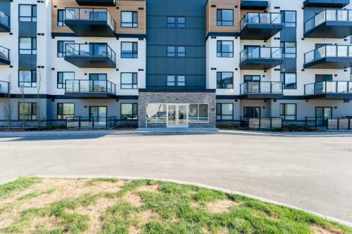 2410-42 Cranbrook Gardens Se, Calgary, AB - Outdoor With Balcony With Facade