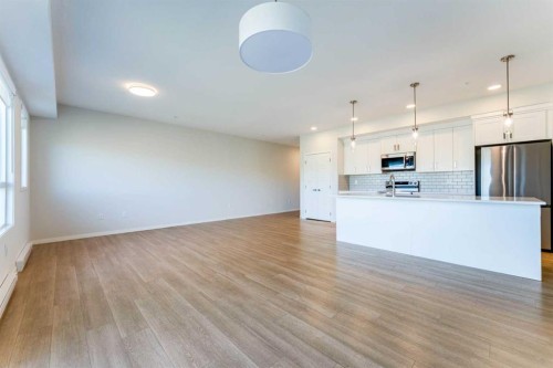2410-42 Cranbrook Gardens Se, Calgary, AB - Indoor Photo Showing Kitchen With Stainless Steel Kitchen With Upgraded Kitchen