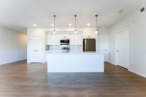 2410-42 Cranbrook Gardens Se, Calgary, AB - Indoor Photo Showing Kitchen With Upgraded Kitchen