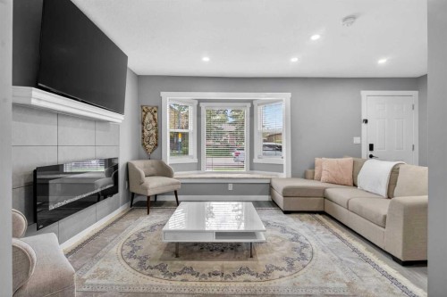 2418 27 Street Se, Calgary, AB - Indoor Photo Showing Living Room With Fireplace