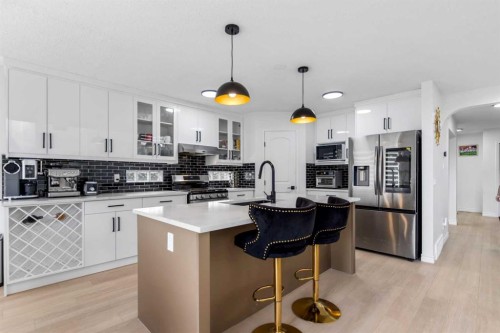 7 Country Hills Park Nw, Calgary, AB - Indoor Photo Showing Kitchen With Stainless Steel Kitchen With Upgraded Kitchen
