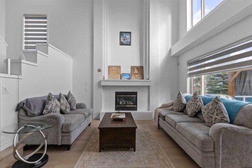7 Country Hills Park Nw, Calgary, AB - Indoor Photo Showing Living Room With Fireplace