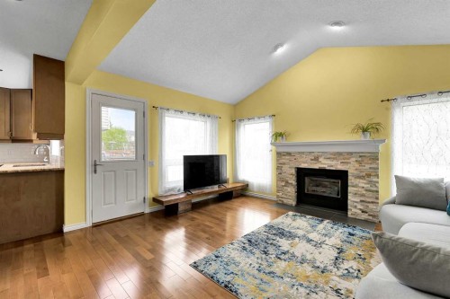 18 Shannon Terrace Sw, Calgary, AB - Indoor Photo Showing Living Room With Fireplace
