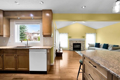 18 Shannon Terrace Sw, Calgary, AB - Indoor Photo Showing Kitchen With Fireplace
