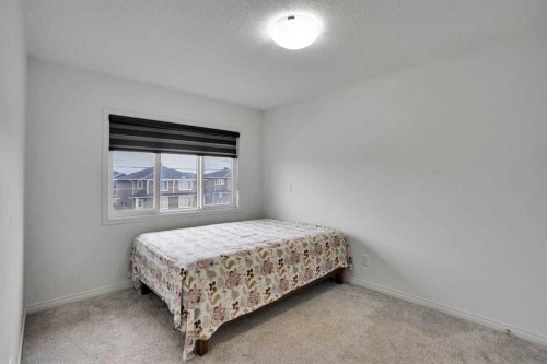 726 Redstone Drive Ne, Calgary, AB - Indoor Photo Showing Bedroom