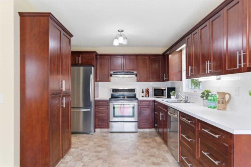 34 Vandoos Gardens Nw, Calgary, AB - Indoor Photo Showing Kitchen With Stainless Steel Kitchen