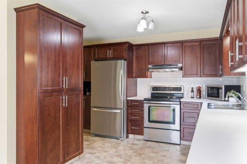 34 Vandoos Gardens Nw, Calgary, AB - Indoor Photo Showing Kitchen With Stainless Steel Kitchen With Double Sink