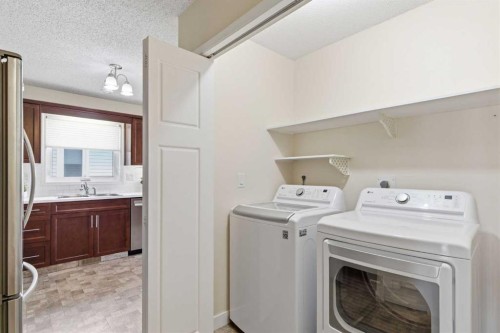 34 Vandoos Gardens Nw, Calgary, AB - Indoor Photo Showing Laundry Room