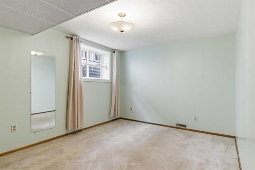 34 Vandoos Gardens Nw, Calgary, AB - Indoor Photo Showing Other Room