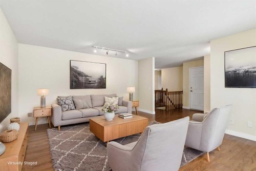 34 Vandoos Gardens Nw, Calgary, AB - Indoor Photo Showing Living Room