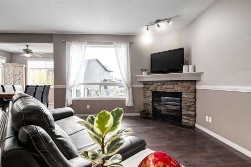 34 Morningside Landing Sw, Airdrie, AB - Indoor Photo Showing Living Room With Fireplace