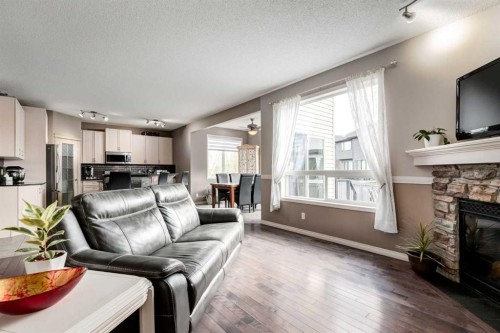 34 Morningside Landing Sw, Airdrie, AB - Indoor Photo Showing Living Room With Fireplace