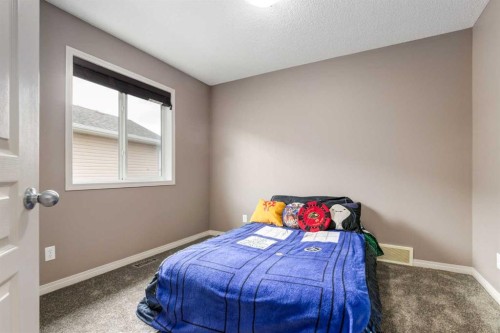 34 Morningside Landing Sw, Airdrie, AB - Indoor Photo Showing Bedroom