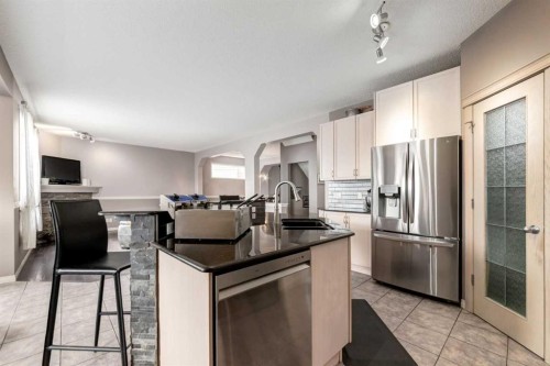 34 Morningside Landing Sw, Airdrie, AB - Indoor Photo Showing Kitchen With Double Sink