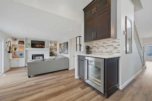 38 Sandpiper Way Nw, Calgary, AB - Indoor Photo Showing Other Room With Fireplace