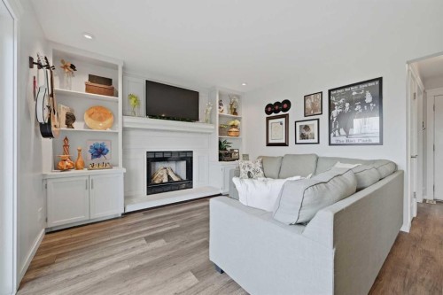 38 Sandpiper Way Nw, Calgary, AB - Indoor Photo Showing Living Room With Fireplace
