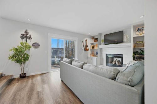 38 Sandpiper Way Nw, Calgary, AB - Indoor Photo Showing Living Room With Fireplace