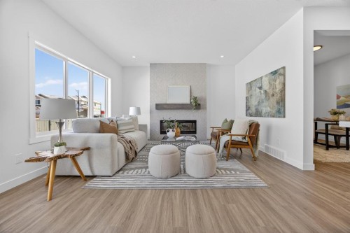1090 Bayview Crescent, Airdrie, AB - Indoor Photo Showing Living Room With Fireplace