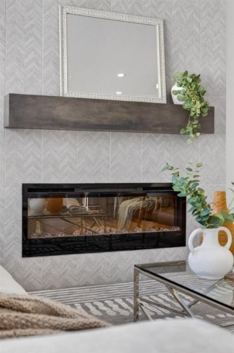 1090 Bayview Crescent, Airdrie, AB - Indoor With Fireplace