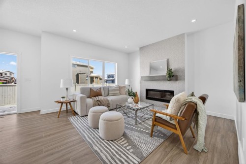 1090 Bayview Crescent, Airdrie, AB - Indoor Photo Showing Living Room With Fireplace