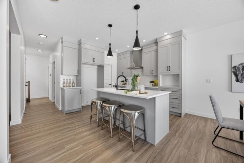 1090 Bayview Crescent, Airdrie, AB - Indoor Photo Showing Kitchen With Upgraded Kitchen