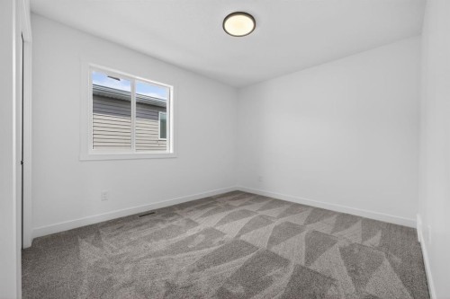 1090 Bayview Crescent, Airdrie, AB - Indoor Photo Showing Other Room