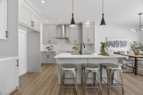 1090 Bayview Crescent, Airdrie, AB - Indoor Photo Showing Kitchen With Upgraded Kitchen