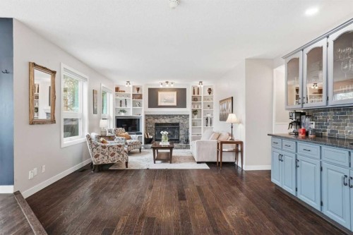 19 Hawkside Close Nw, Calgary, AB - Indoor Photo Showing Living Room With Fireplace
