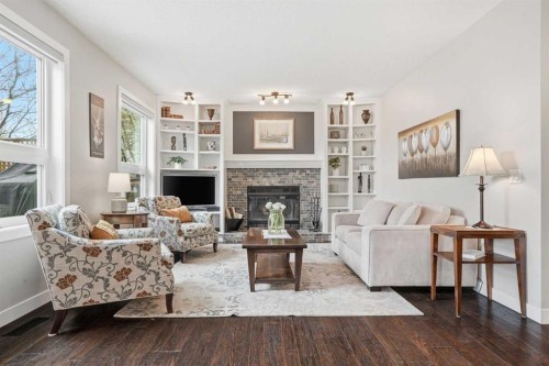 19 Hawkside Close Nw, Calgary, AB - Indoor Photo Showing Living Room With Fireplace