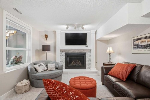 19 Hawkside Close Nw, Calgary, AB - Indoor Photo Showing Living Room With Fireplace