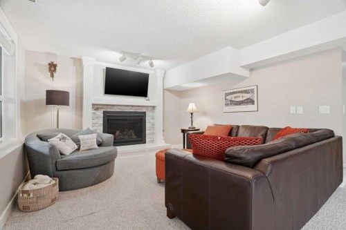 19 Hawkside Close Nw, Calgary, AB - Indoor Photo Showing Living Room With Fireplace