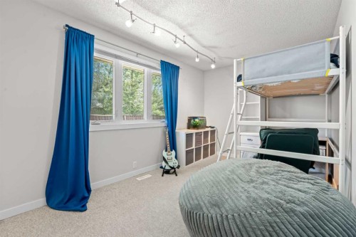 232 Ranchview Place Nw, Calgary, AB - Indoor Photo Showing Bedroom