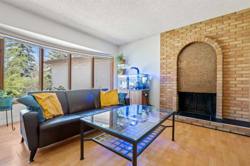 232 Ranchview Place Nw, Calgary, AB - Indoor Photo Showing Living Room With Fireplace