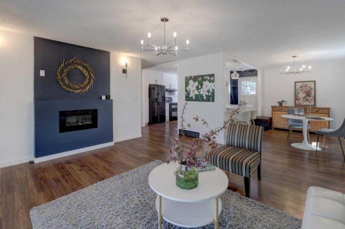 460 Parkridge Crescent Se, Calgary, AB - Indoor Photo Showing Living Room With Fireplace