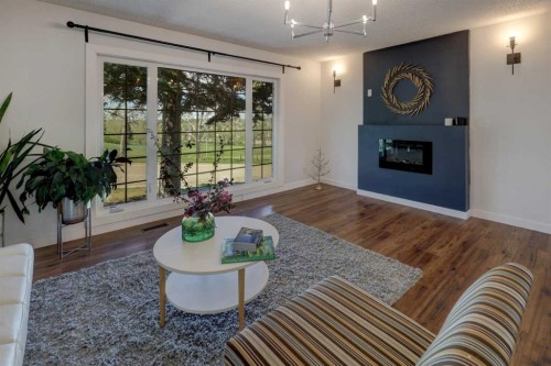 460 Parkridge Crescent Se, Calgary, AB - Indoor Photo Showing Living Room With Fireplace