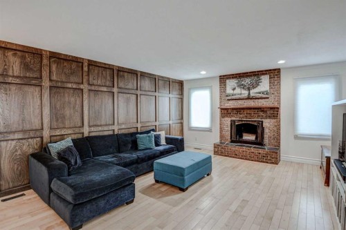 8116 33 Avenue Nw, Calgary, AB - Indoor Photo Showing Living Room With Fireplace
