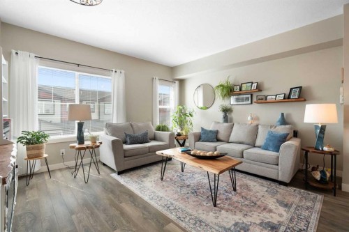 1306 Jumping Pound Common, Cochrane, AB - Indoor Photo Showing Living Room
