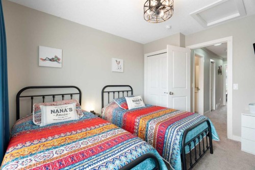 1306 Jumping Pound Common, Cochrane, AB - Indoor Photo Showing Bedroom