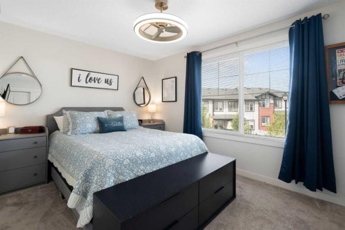 1306 Jumping Pound Common, Cochrane, AB - Indoor Photo Showing Bedroom