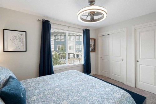 1306 Jumping Pound Common, Cochrane, AB - Indoor Photo Showing Bedroom