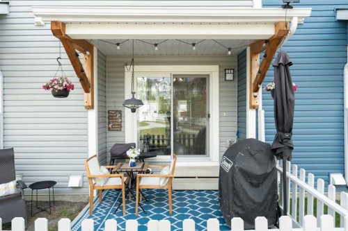 1306 Jumping Pound Common, Cochrane, AB - Outdoor With Deck Patio Veranda With Exterior