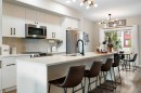 1306 Jumping Pound Common, Cochrane, AB  - Indoor Photo Showing Kitchen With Upgraded Kitchen 
