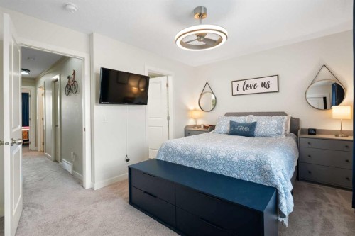 1306 Jumping Pound Common, Cochrane, AB - Indoor Photo Showing Bedroom