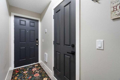 1306 Jumping Pound Common, Cochrane, AB - Indoor Photo Showing Other Room