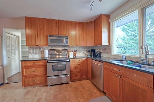 5940 Dalkeith Hill Nw, Calgary, AB - Indoor Photo Showing Kitchen With Stainless Steel Kitchen With Double Sink